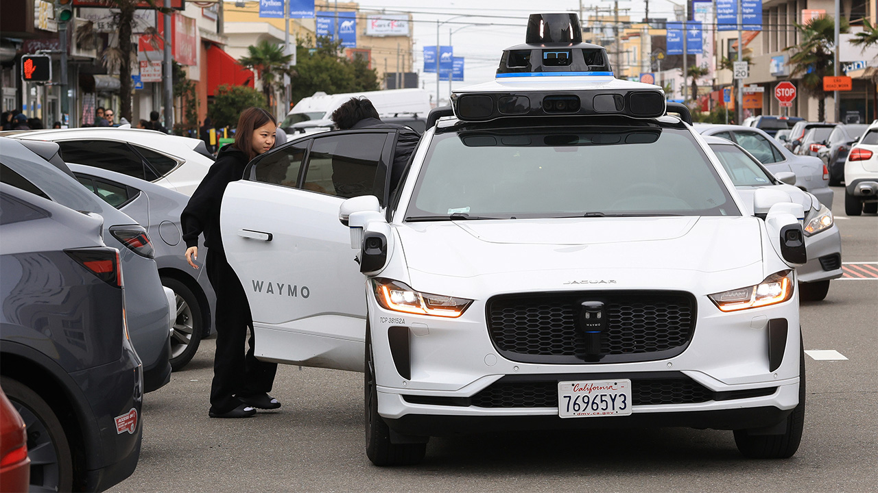 waymo vehicle picks up passenger
