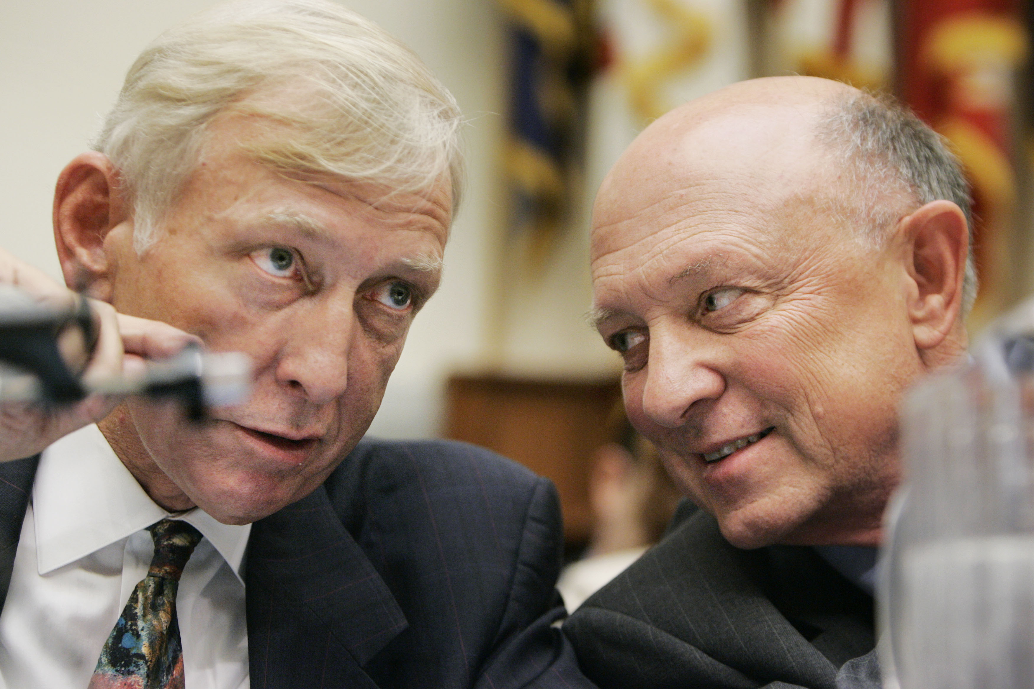 R. James Woolsey (right) and Richard D'Amato, chairman, U.S.- China Economic and Security Review Commission, confer as they testify before the House Armed Services Committee on Capitol Hill on July 13, 2005.