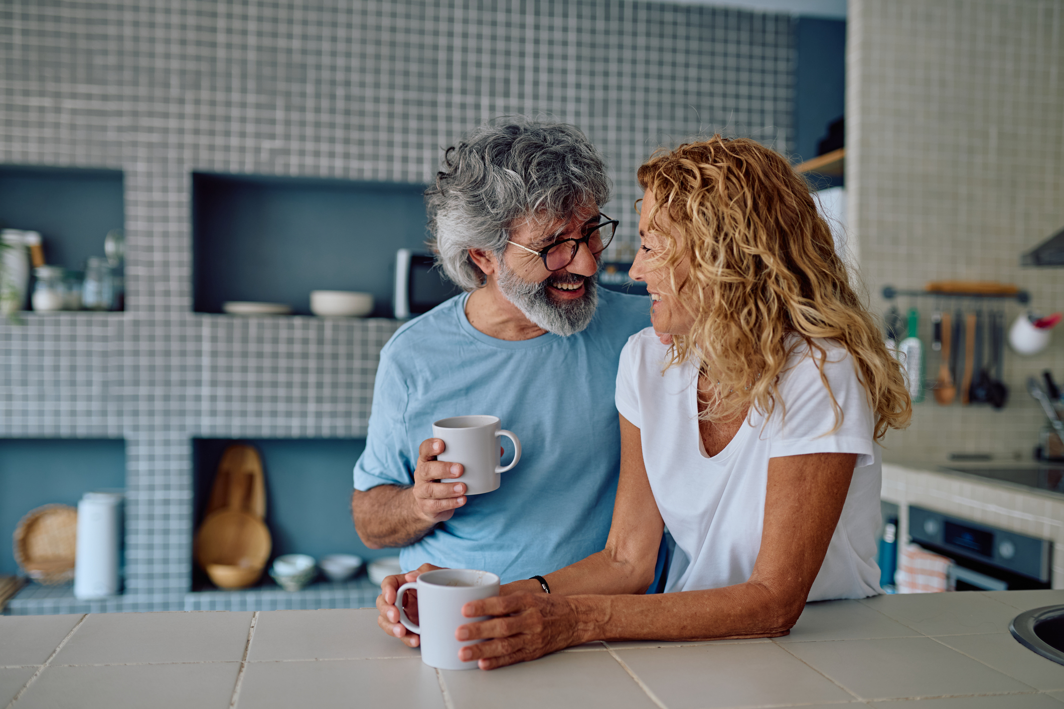 Older couple relaxing in the kitchen