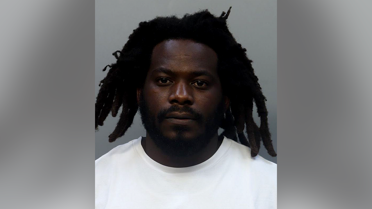 Teachers who once dated and share child arrested after classroom argument spiraled into violence: police