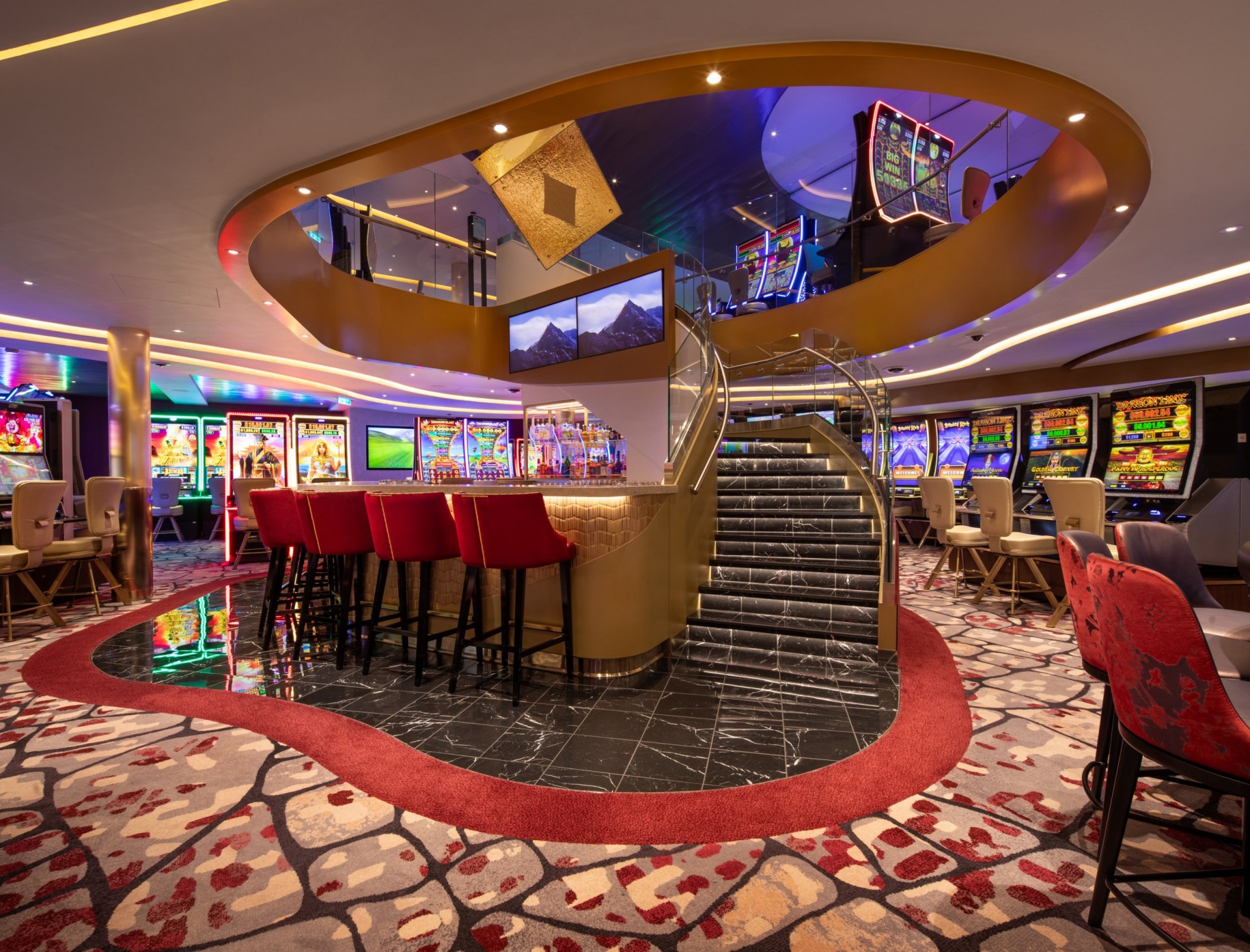 The casino and staircase leading down to it on Legend of the Seas.