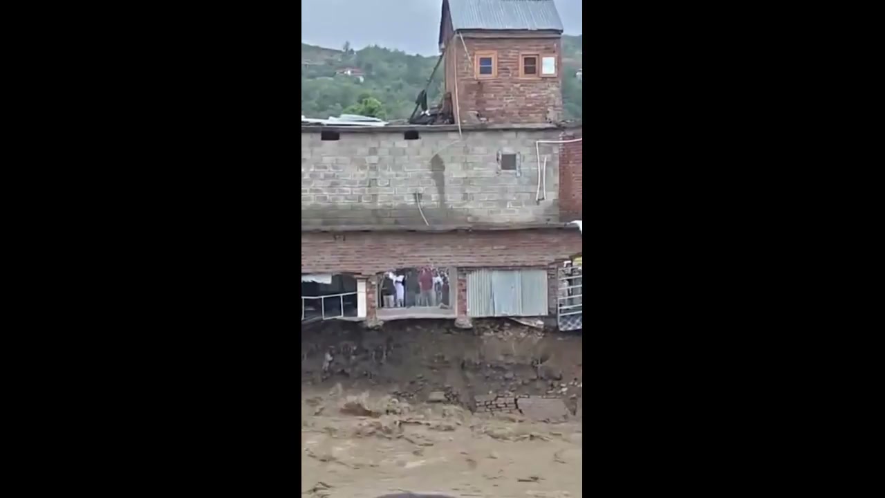 Moment buildings crash into river during India floods