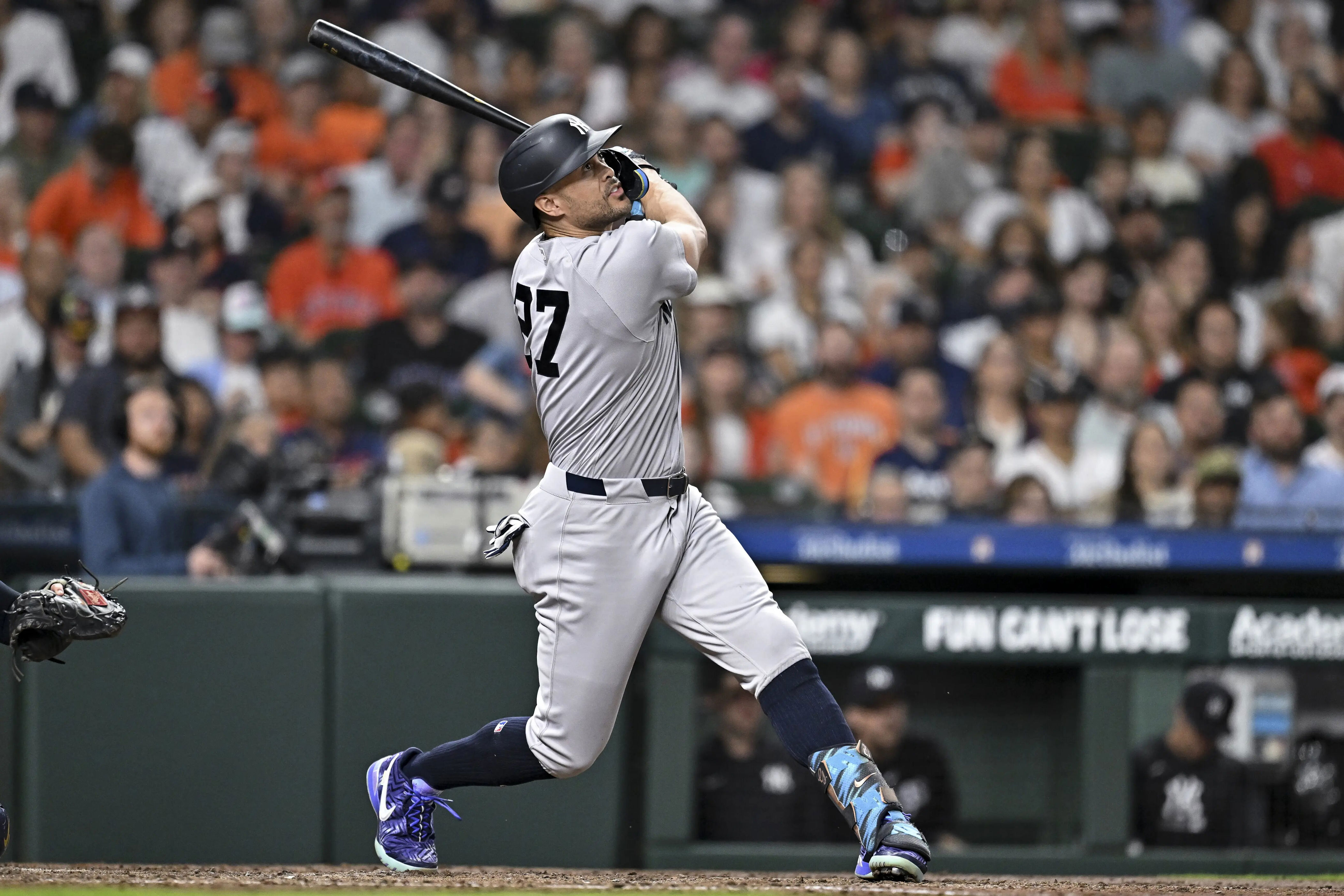 Apr 24, 2026; Houston, Texas, USA; New York Yankees designated hitter Giancarlo Stanton (27) hits the ball in the third inning against the Houston Astros at Daikin Park. Stanton's chronic injury issues could limit his time with the Ya… | Source: Lastwordonsports.com - Matthew Nethercott, Site Editor