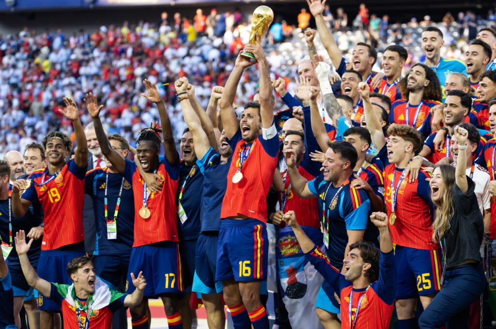 July 19, 2026; East Rutherford, New Jersey, U.S.; Spain captain Rodri lifts the World Cup trophy alongside teammates as they celebrate defeating Argentina during the FIFA World Cup Final at New York New Jersey Stadium. Mandatory Credit: Mark J. Rebilas-Imagn Images