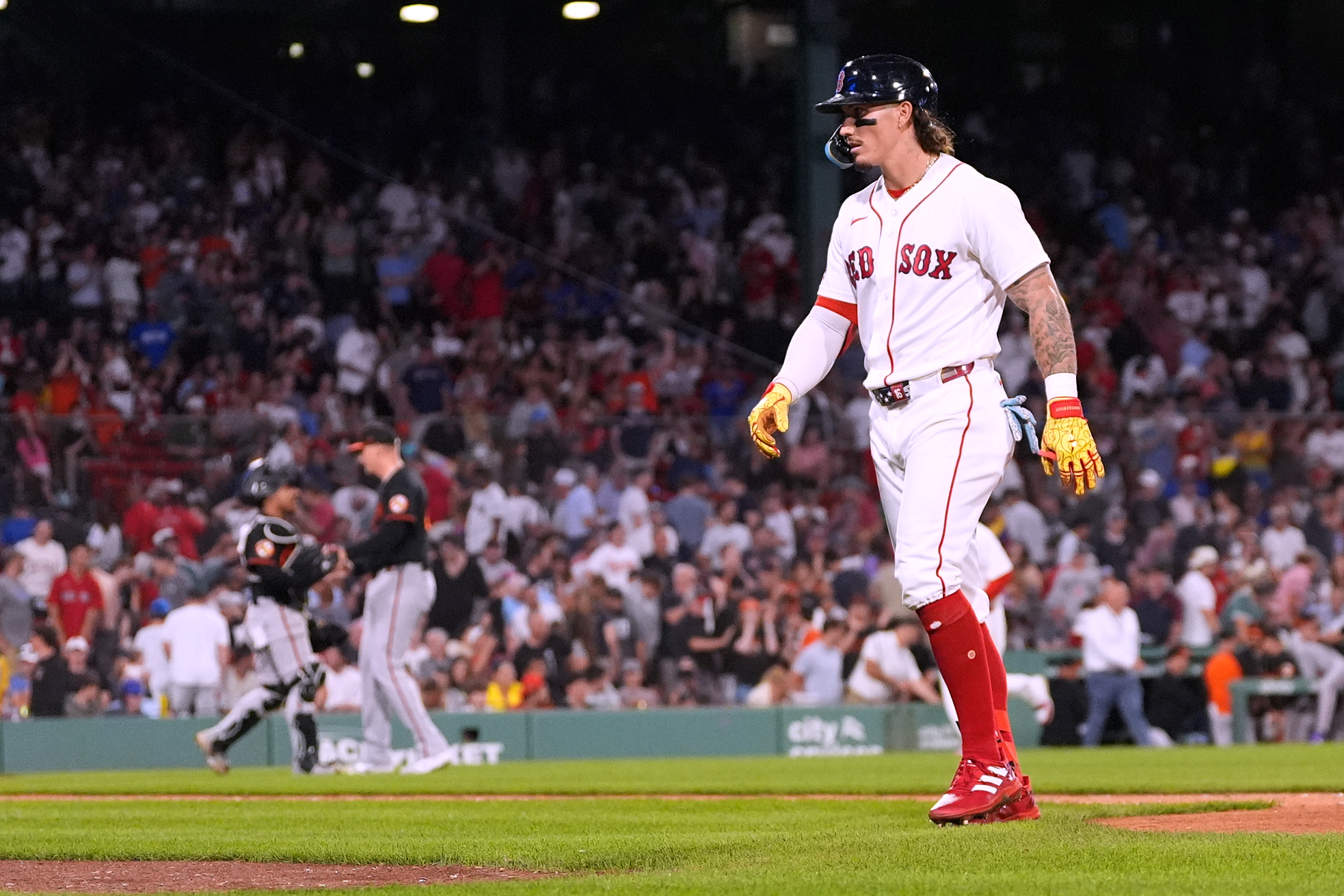 Boston Red Sox's Jarren Duran heads to the dugout after flying out to end the second baseball game of a doubleheader against the Baltimore Orioles, Wednesday, July 22, 2026, in Boston. (AP Photo/Charles Krupa)