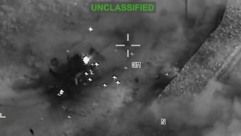 Smoke rises from heavy machinery, at an unknown location, following during what the U.S. Central Command (CENTCOM) says are strikes on Iran