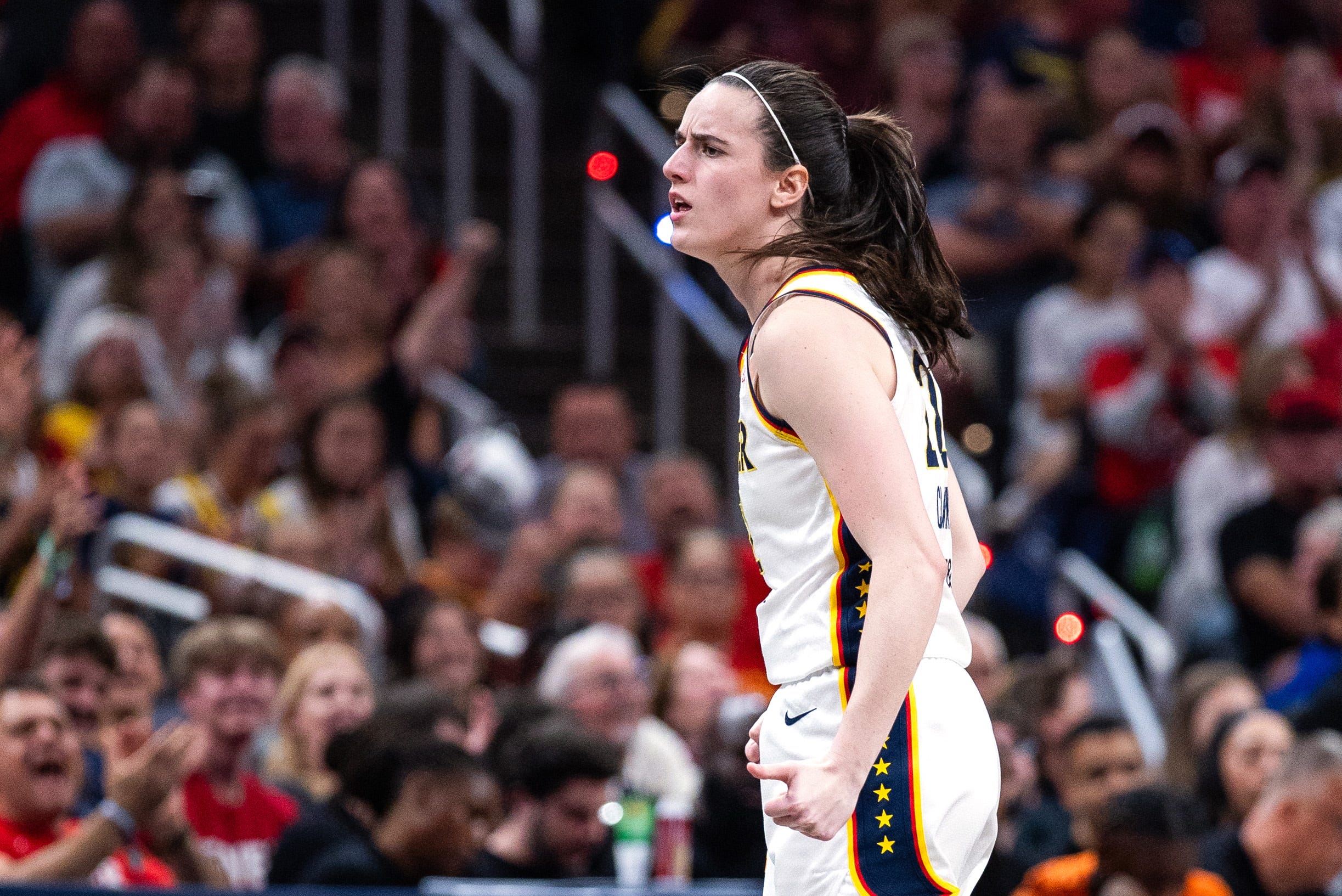 Jul 22, 2026; Indianapolis, Indiana, USA; Indiana Fever guard Caitlin Clark (22) celebrates a made shot in the first half against the Connecticut Sun at Gainbridge Fieldhouse. Mandatory Credit: Trevor Ruszkowski-Imagn Images