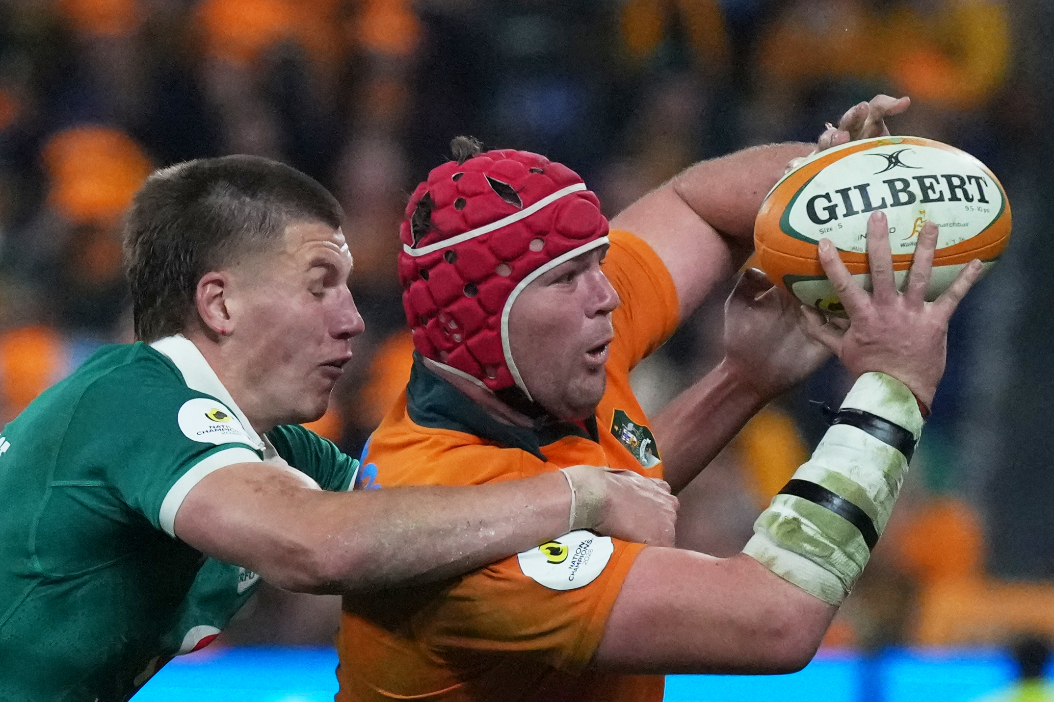 Ireland's Sam Prendergast, tackles Australia's Harry Wilson, who get the ball, away during the Nations Championship rugby international between Australia and Ireland in Sydney, Saturday July, 4, 2026. (AP Photo/Mark Baker)