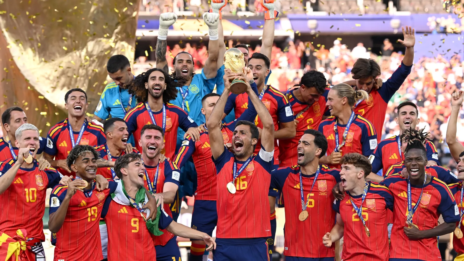 Rodri #16 of Spain lifts the FIFA World Cup Winner’s Trophy.
