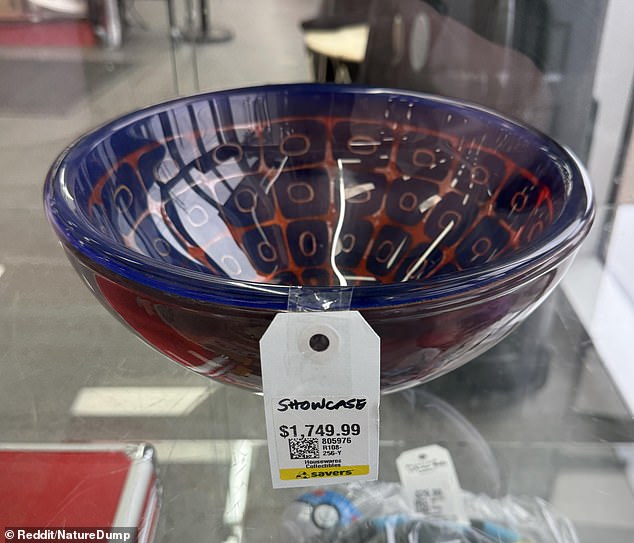 A shopper shared a photo online of a decorative glass bowl locked inside a display cabinet with a price tag of $1,749.99