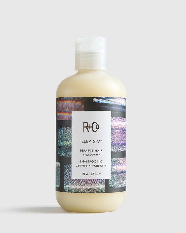 R+Co Television Perfect Hair Shampoo bottle with a label showcasing a retro TV screen pattern, 8.5 fl. oz
