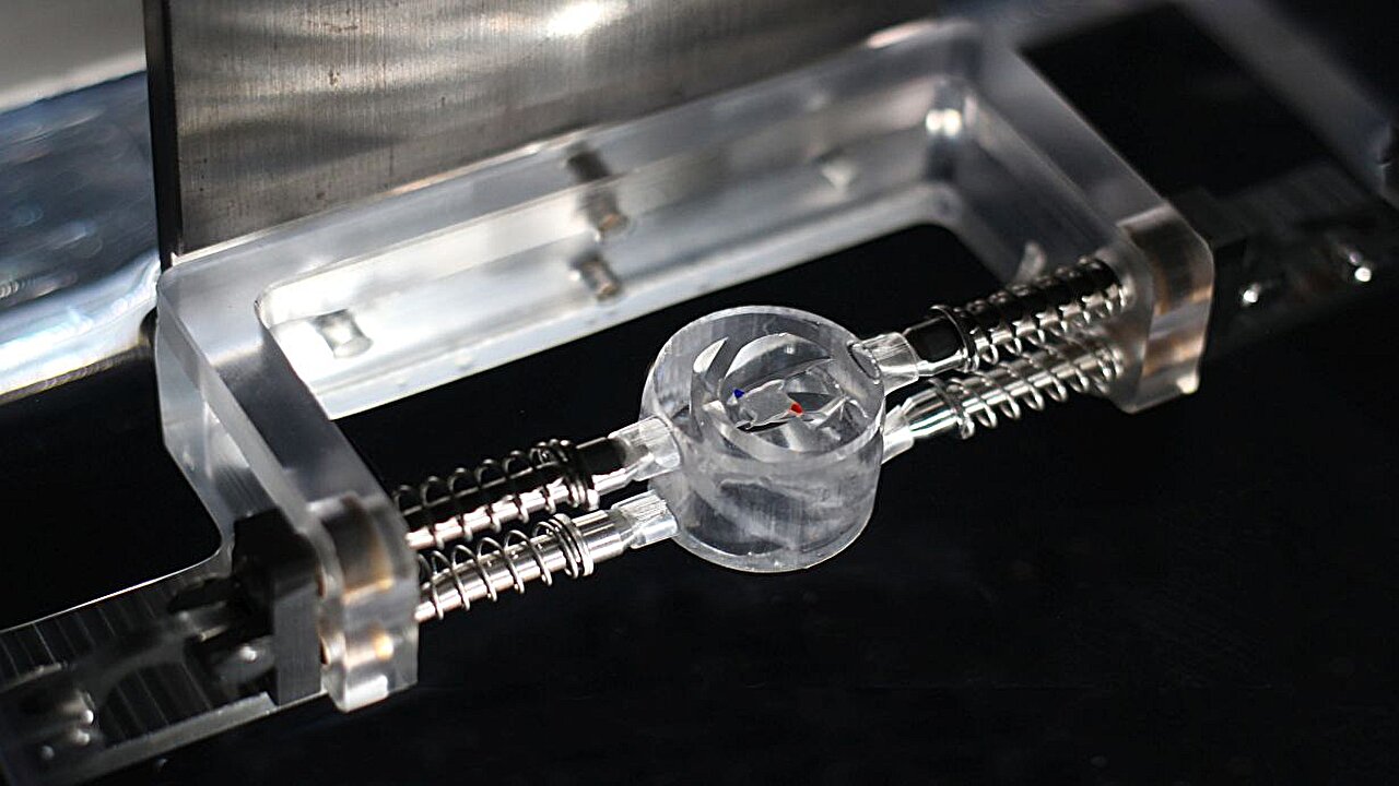 Water-surface vortices drive tiny rotors without electricity, magnets or chemicals