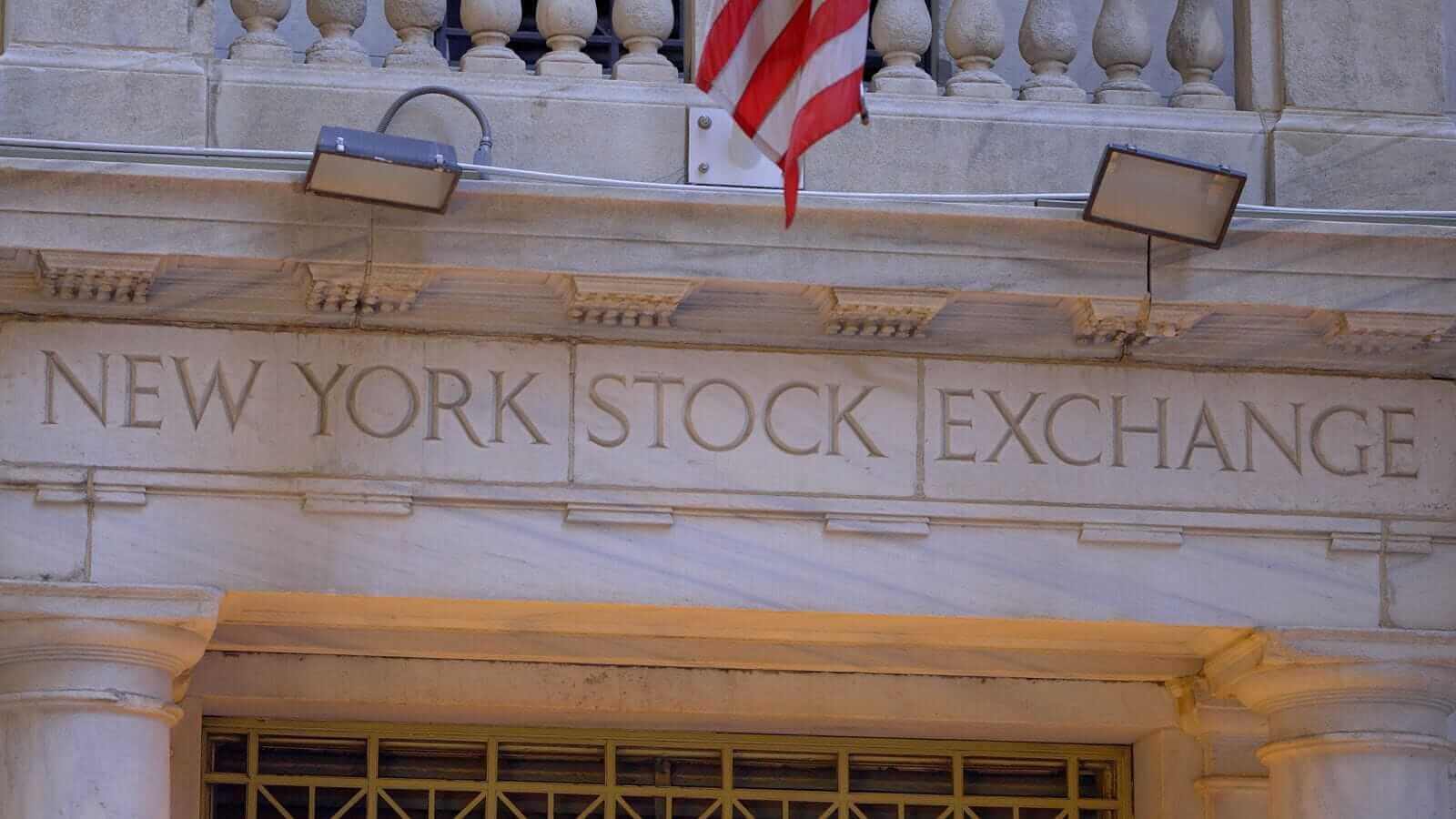 Stocks settle lower as crude oil prices jump