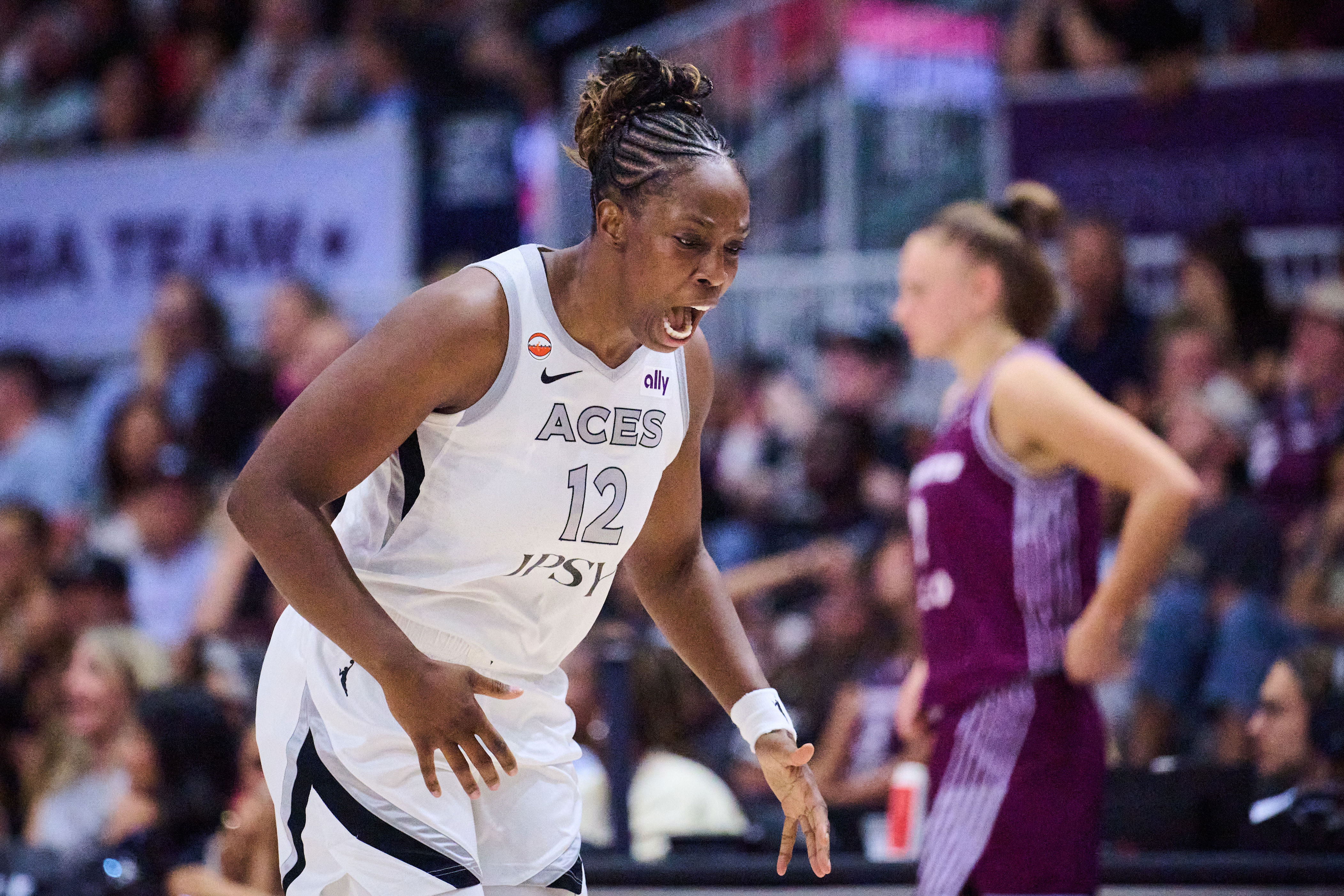 Las Vegas Aces' Chelsea Gray (12) reacts after scoring against the Toronto Tempo during the first half of a WNBA basketball game in Toronto, on Monday, July 20, 2026. (Sammy Kogan/The Canadian Press via AP)