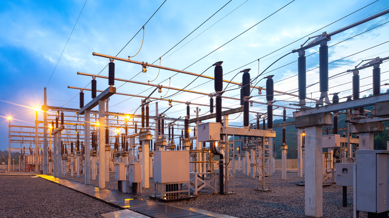 A large electric substation at dusk