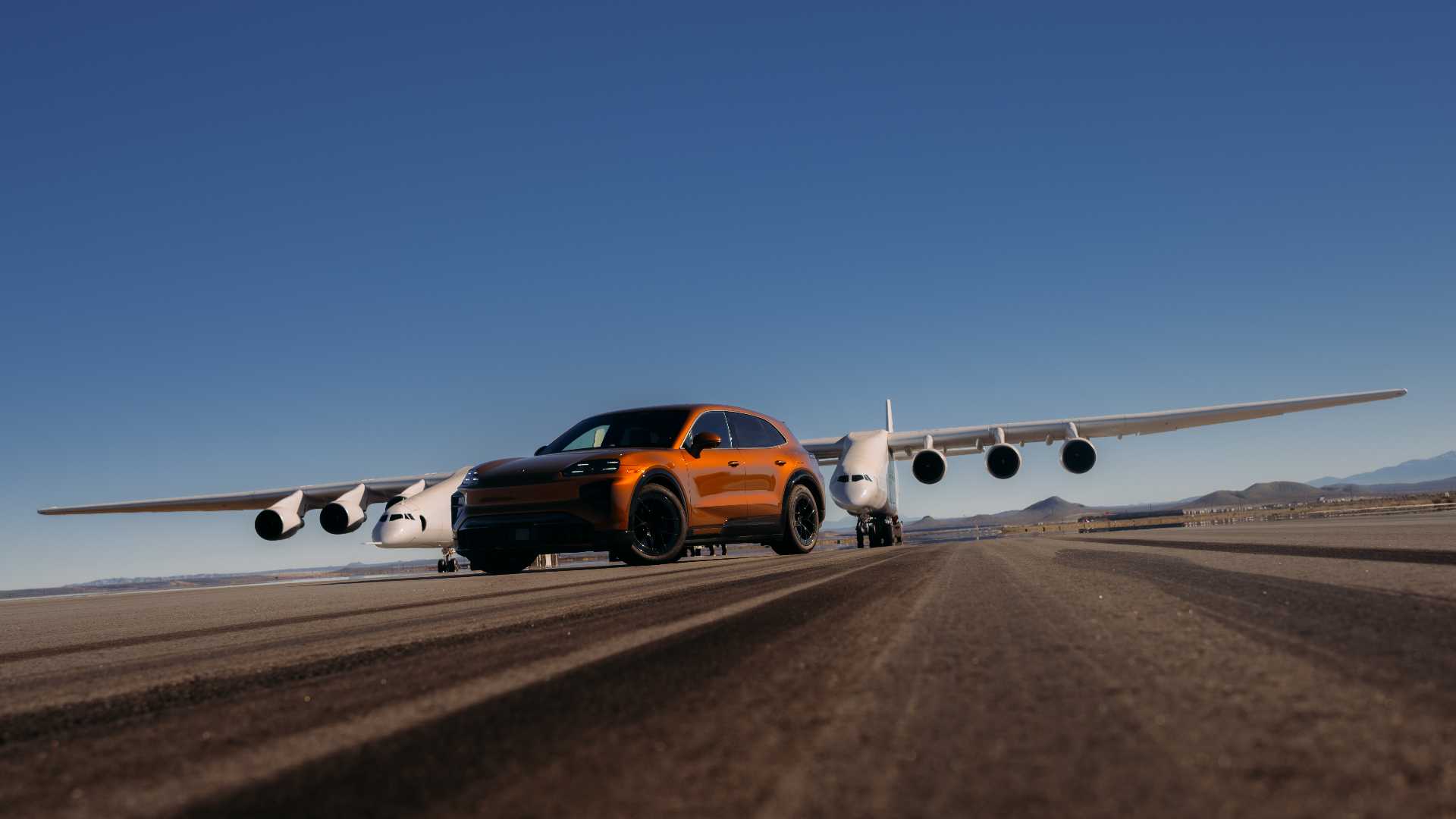 image-of-porsche-cayenne-turbo-electric-drove-beneath-the-worlds-biggest-aircraft