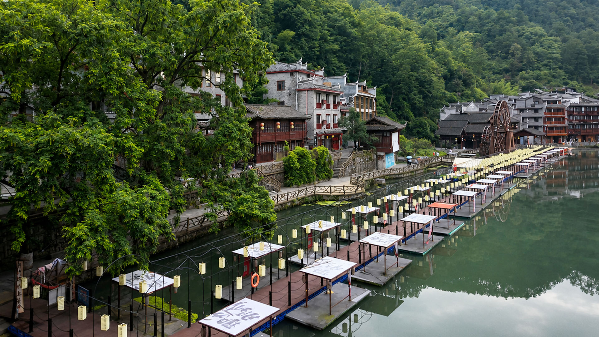 China's ancient riverside village features traditional houses and calm ...
