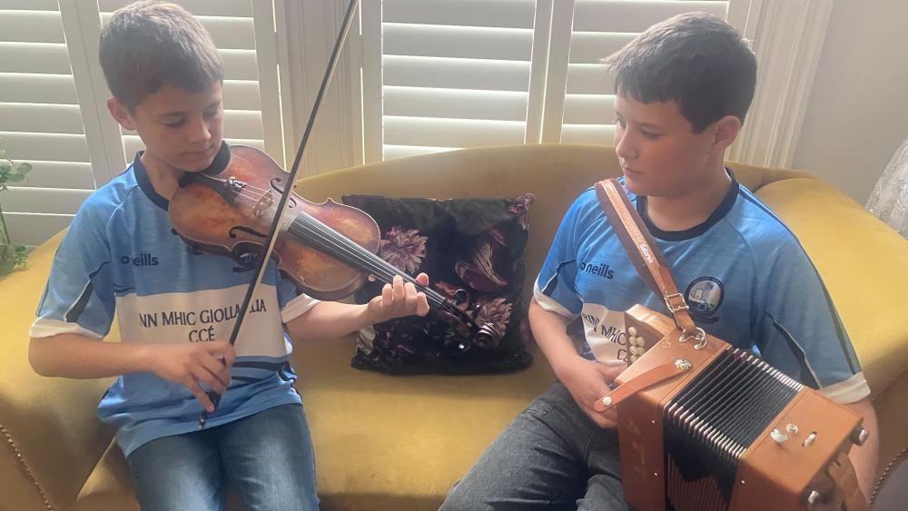 Ayman and Rayan rehearse together at home