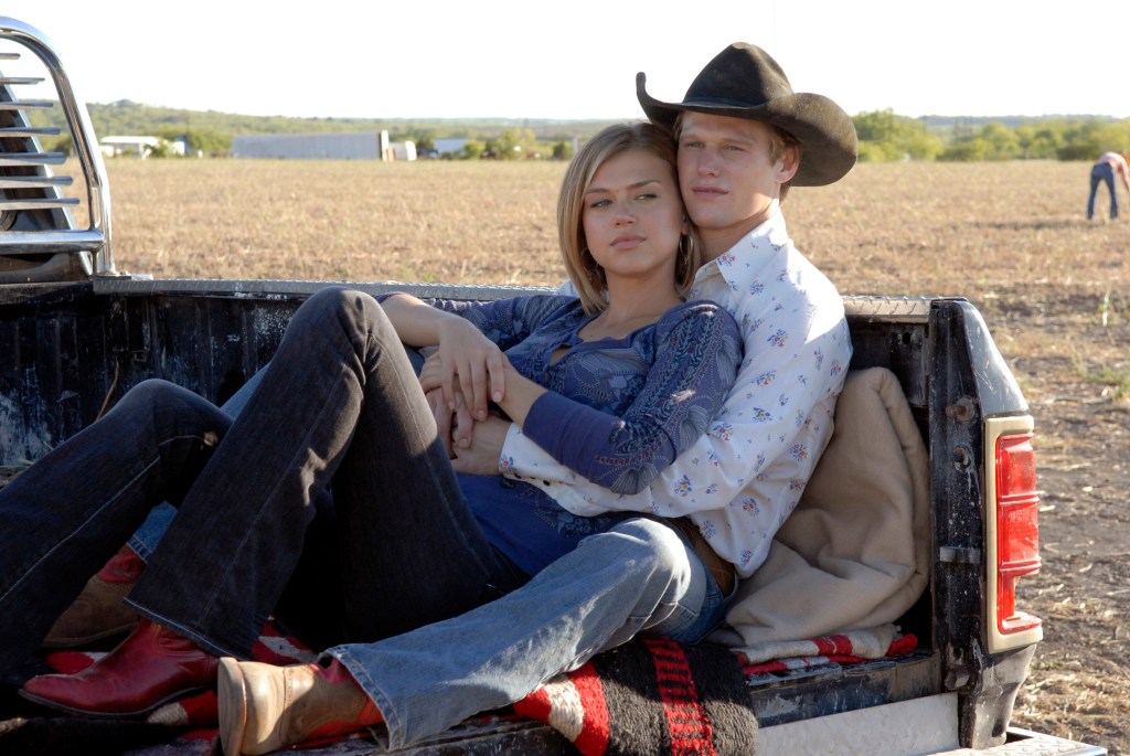Adrianne Palicki and Zach Roerig in a truck bed in
