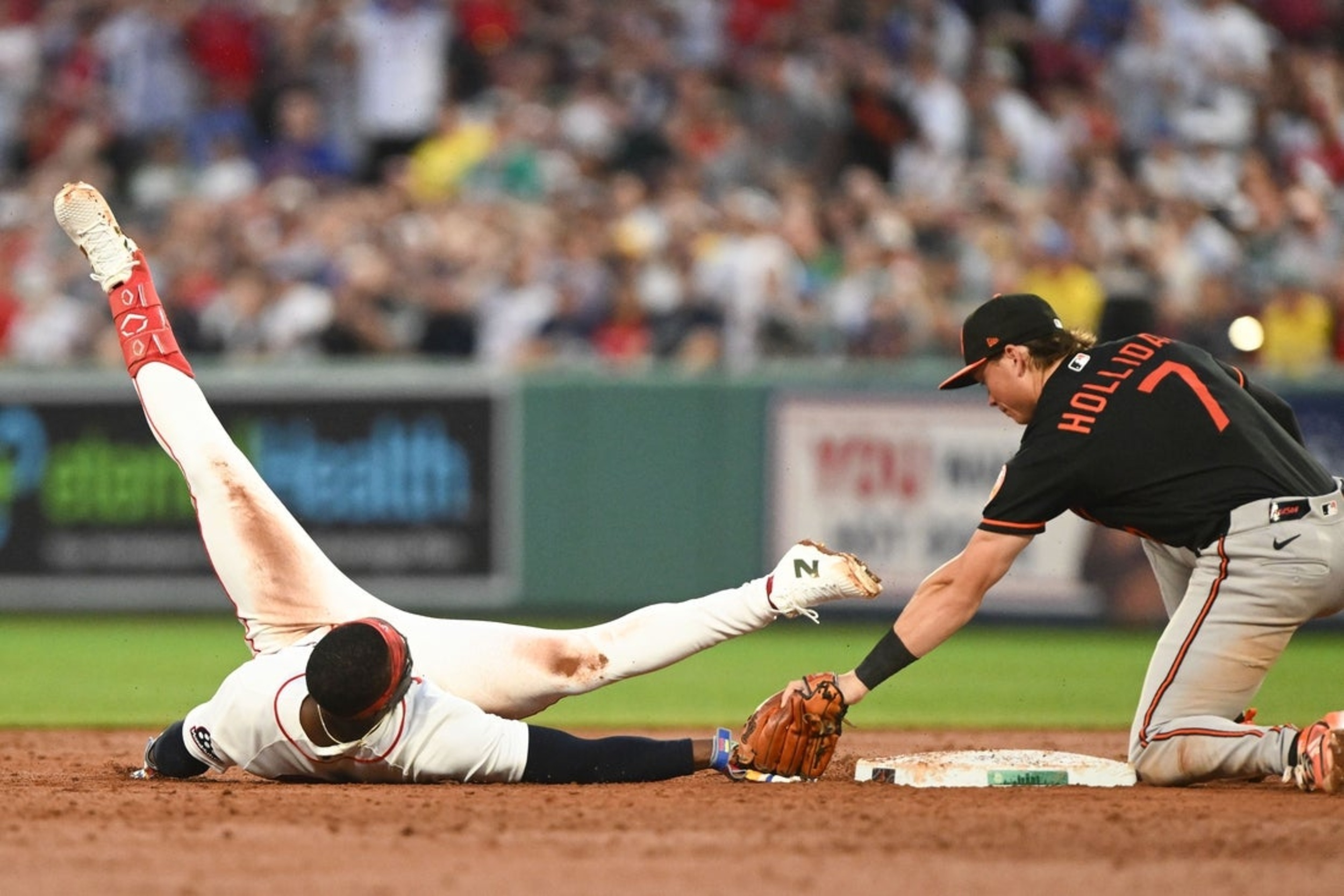 Orioles score 4 in first, end Red Sox's winning streak at 15