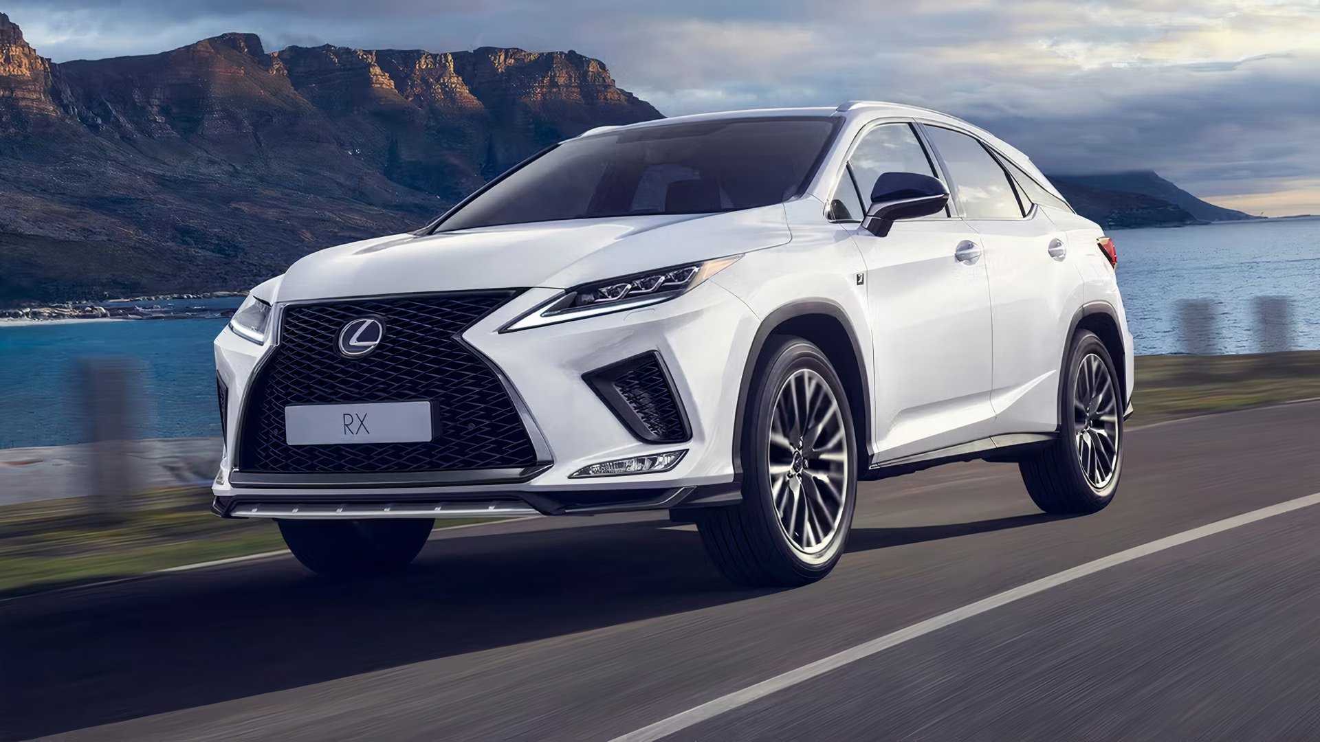 2021 Lexus RX Hybrid in white driving along lake road