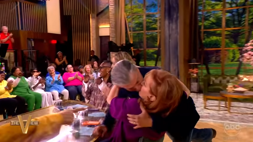 ‘The View’ star Joy Behar pulls married guest in for a kiss on the lips