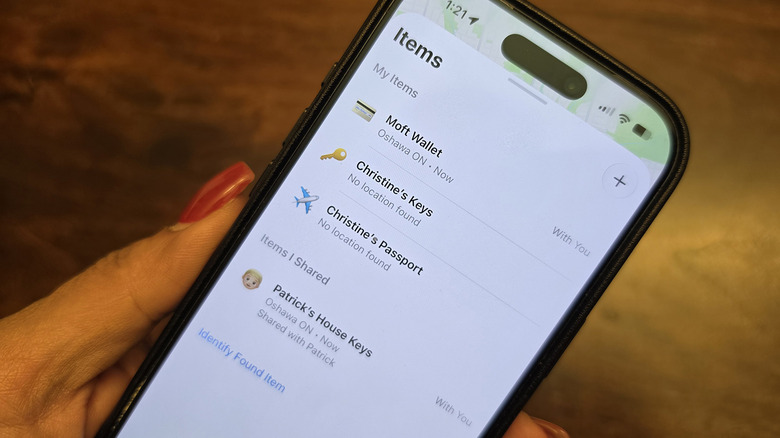 An iPhone showing third-party items tracked in the Find My app.