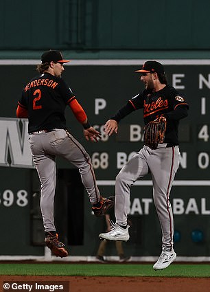 The Orioles celebrate their win over the Red Sox
