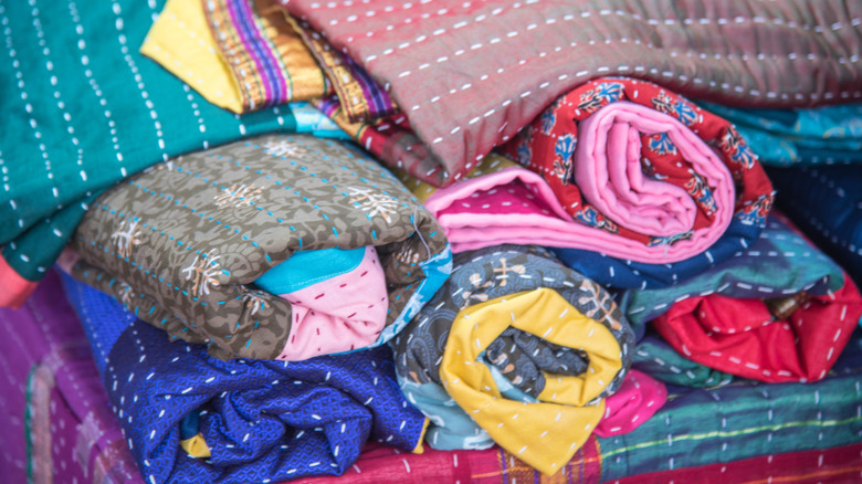 Upcycle thrifted quilts into a gorgeous one of a kind tablecloth