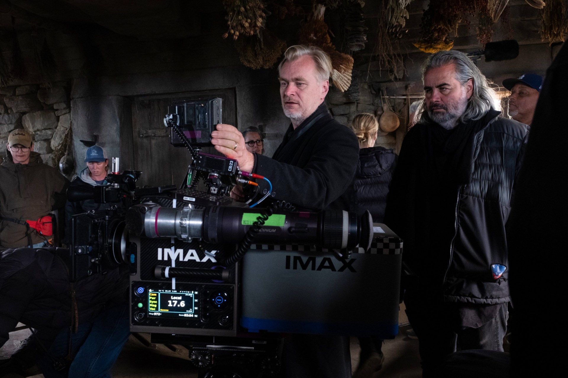 This image released by Universal Pictures shows director Christopher Nolan, center, with cinematographer Hoyte van Hoytema on set of The Odyssey