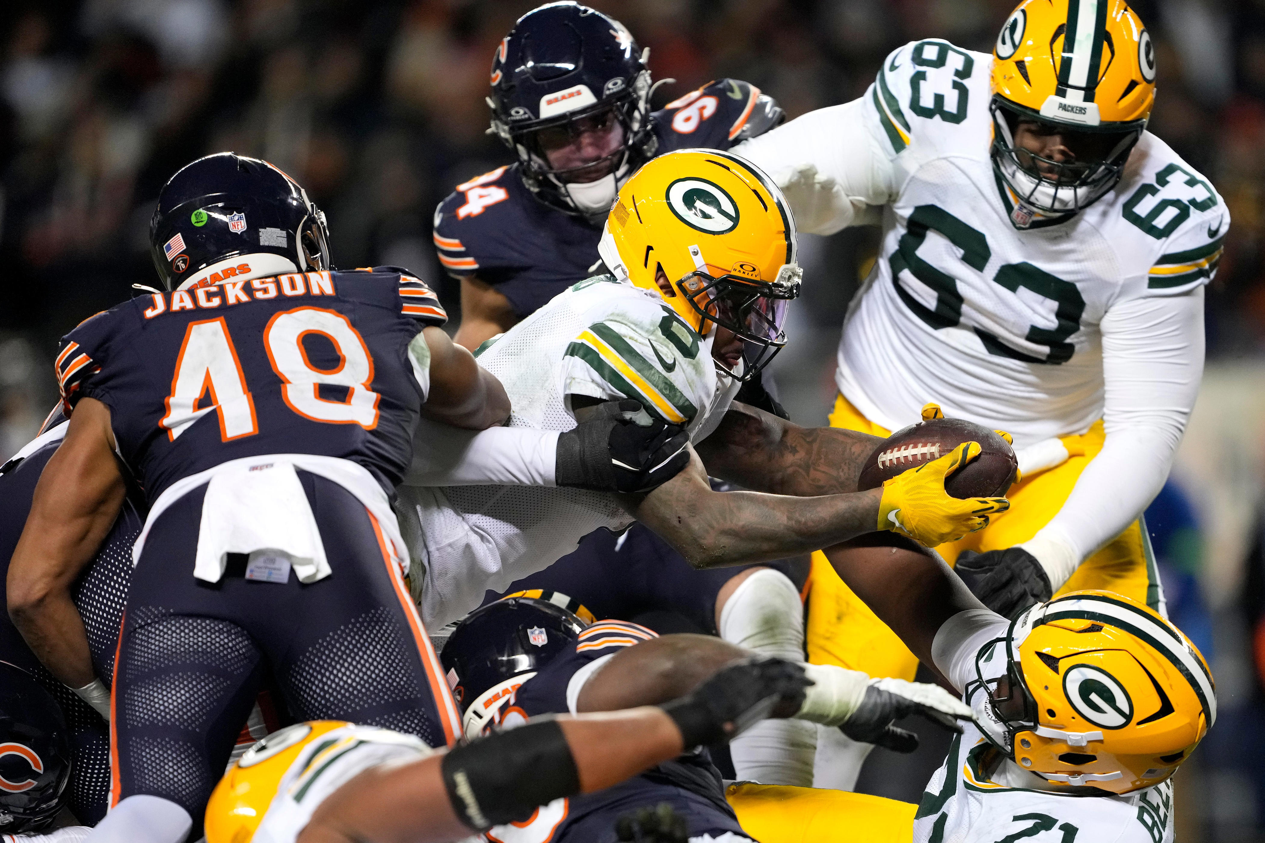 Josh Jacobs #8 of the Green Bay Packers runs the ball against the Chicago Bears during the second quarter in the NFC Wild Card Playoff game at Soldier Field on January 10, 2026 in Chicago, Illinois.