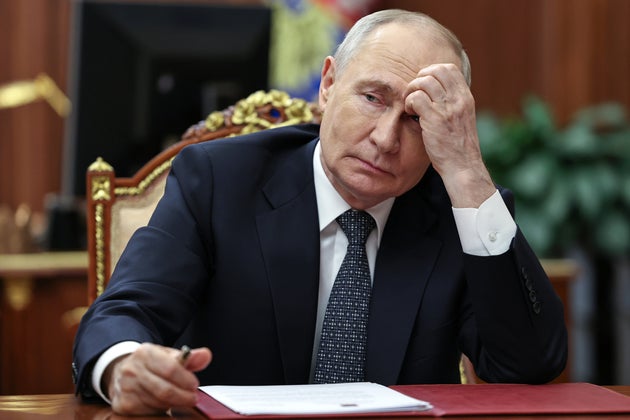 Russian President Vladimir Putin listens to Moscow-appointed head of Russian-controlled Zaporizhzhia region Yevgeny Balitsky during their meeting at the Kremlin in Moscow, Monday, July 20, 2026.