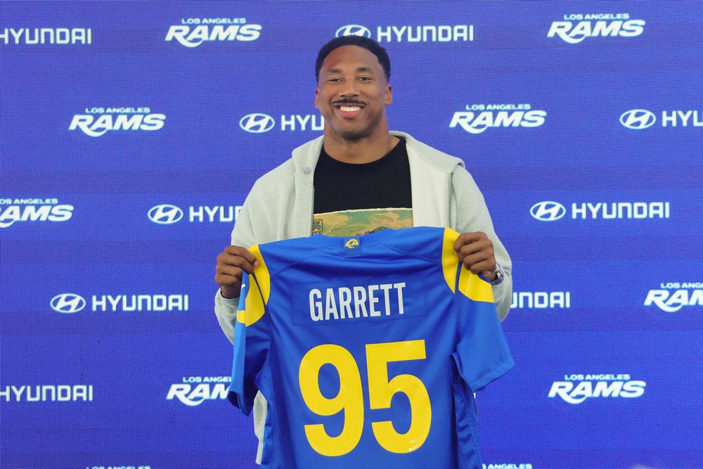 WOODLAND HILLS, CALIFORNIA - JUNE 2: Myles Garrett #95 of the Los Angeles Rams poses with his jersey during a press conference after an organized team activities workout at Rams Village at the Warner Center on June 2, 2026 in Woodland Hills, California. (Photo by WOODLAND HILLS, CALIFORNIA - JUNE 2: Myles Garrett #95 of the Los Angeles Rams poses with his jersey during a press conference after an organized team activities workout at Rams Village at the Warner Center on June 2, 2026 in Woodland Hills, California. (Photo by Kevin Terrell/Getty Images)