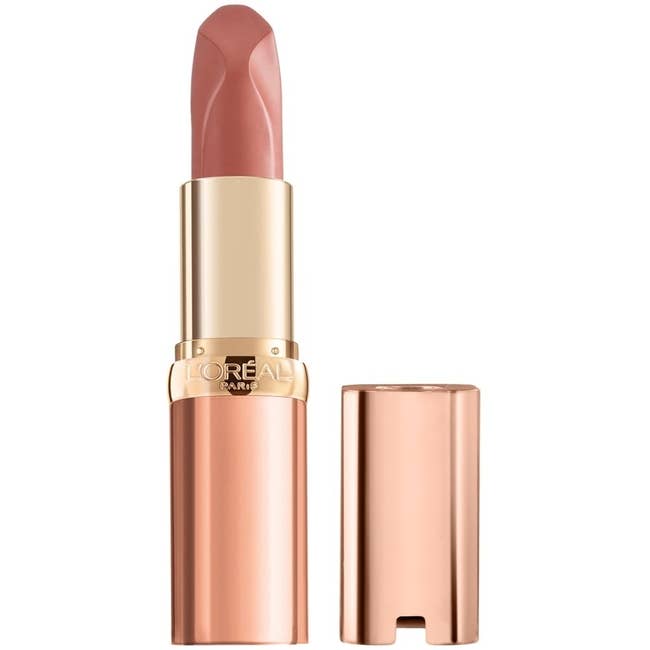 L'Oréal Paris **** lipstick with the cap removed, revealing the lipstick stick. The product has a sleek, metallic packaging