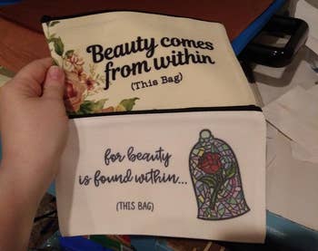 person holding two cosmetic bags