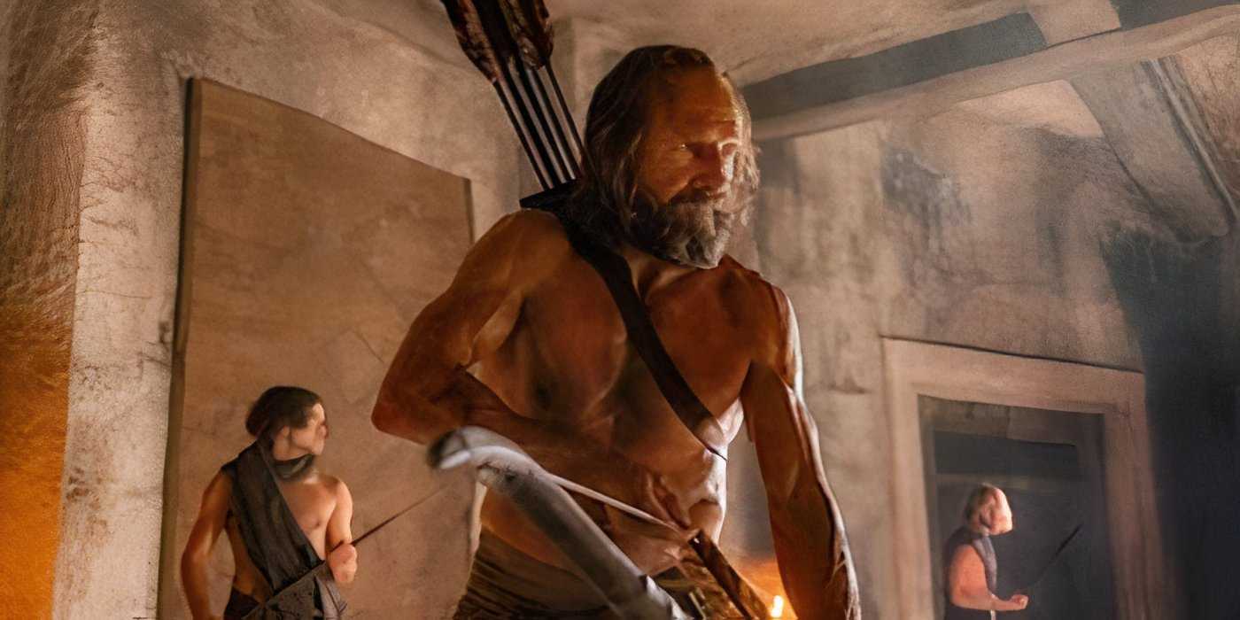Ralph Fiennes holds a bow in The Return still