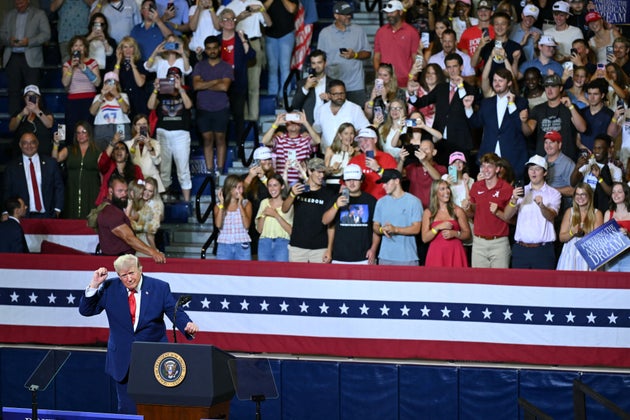 President Donald Trump pumps his fist after speaking at Wheeler High School in Marietta, Ga., on July 22, 2026.