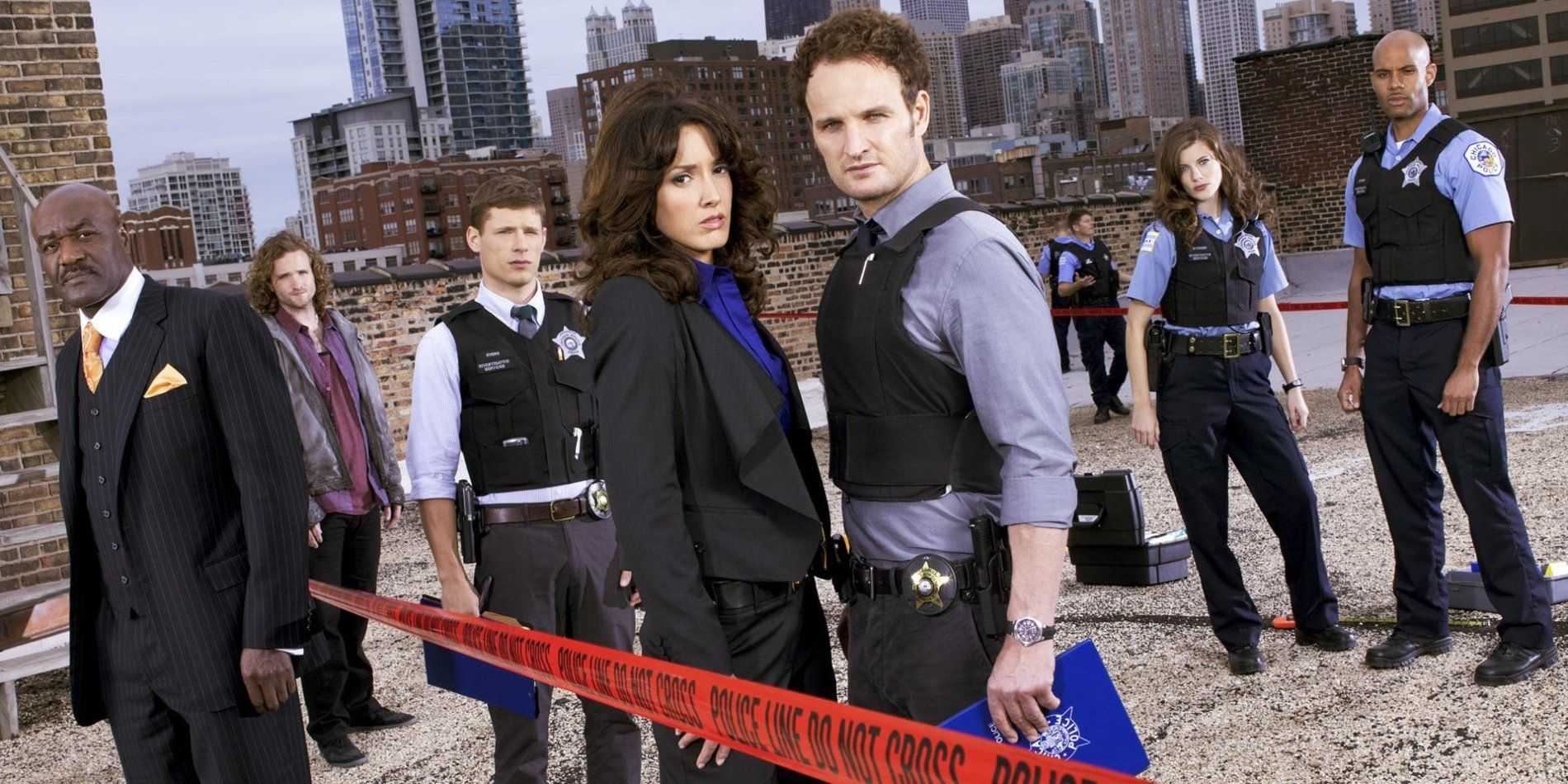 The cast of The Chicago Code pose on a rooftop crime scene