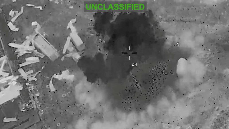 Scattered debris and smoke, at an unknown location, during what the U.S. Central Command (CENTCOM) says are strikes on Iran