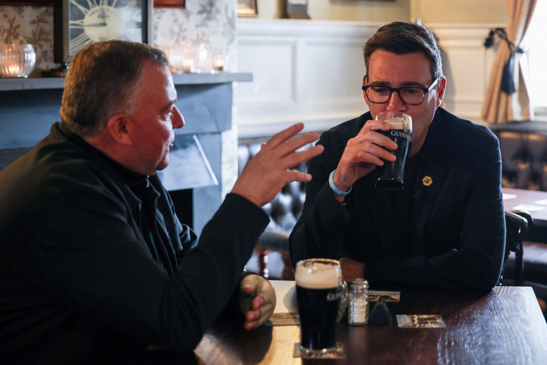 Andy Burnham chats to a pub landlord on the day of a media event ahead of the June 18 Makerfield by-election.