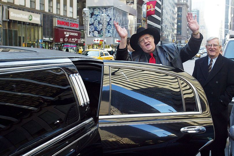 Jack Whittaker waves as he gets into his rented limousine