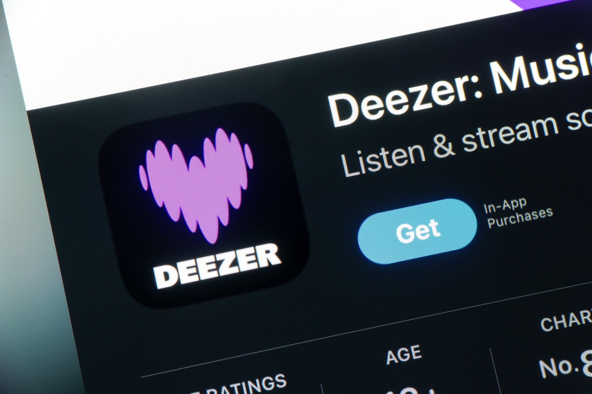 App store with Deezer music streaming mobile application on iOS smartphone.