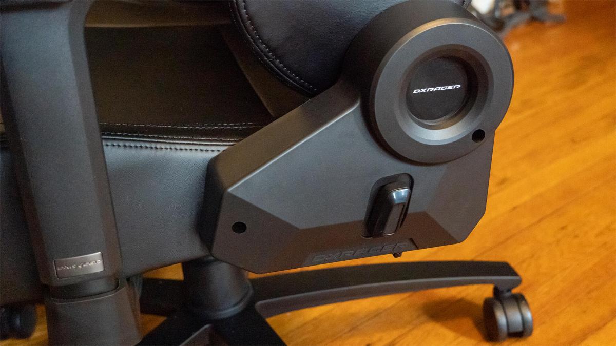 The side and wheel of the DXRacer Martian on a wood floor.