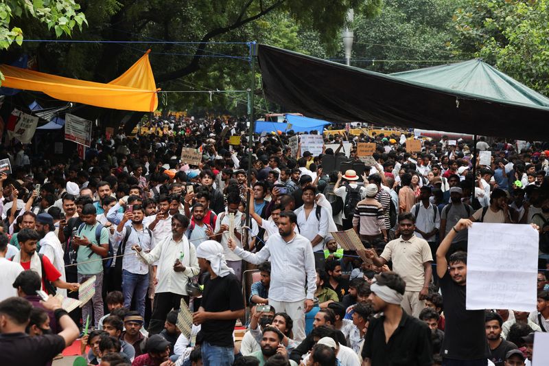 India's Modi promises fast-track courts on exam leaks, protesters want minister to quit