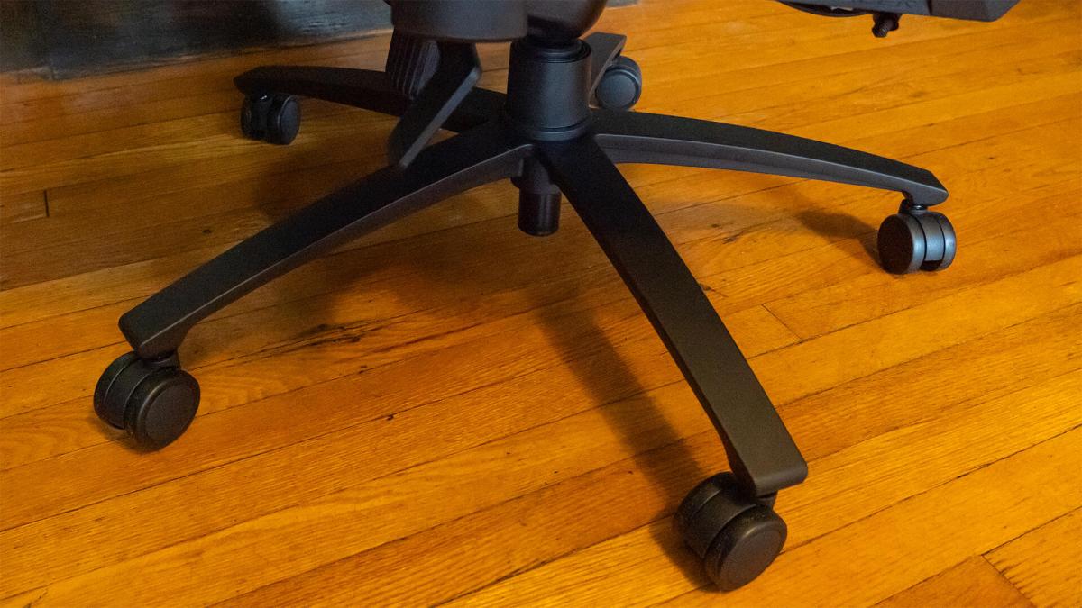 The wheels of the DXRacer Martian on a wood floor.