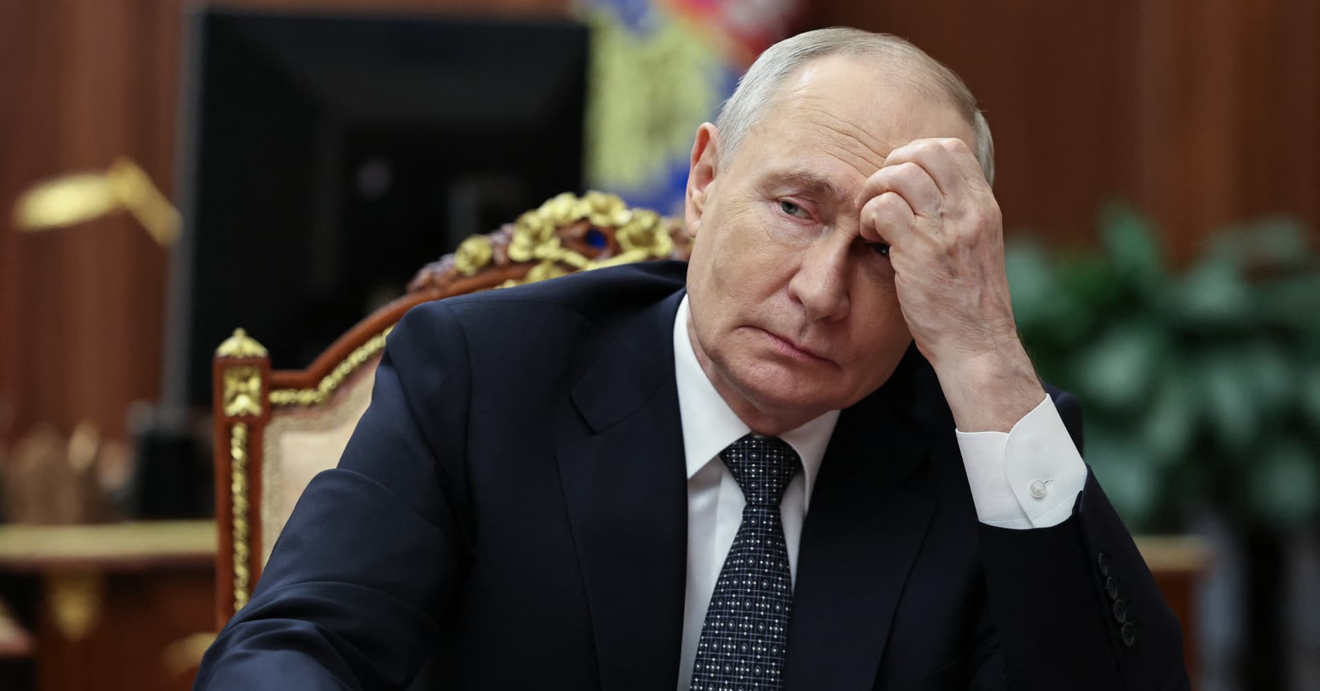 In this pool photograph distributed by the Russian state agency Sputnik, Russia's President Vladimir Putin meets with Moscow-installed leader of the Russian-controlled parts of the Zaporizhzhia region, at the Kremlin in Moscow on July 20, 2026.