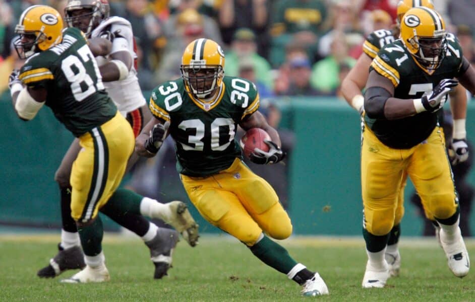Green Bay Packers running back Ahman Green runs though a hole in the Tampa Bay Buccanneer’s defense for an 11-yard gain during the third quarter of their game on Sept. 25, 2005 at Lambeau Field in Green Bay, Wis. Tampa Bay won 17-16. © Mark Hoffman/Milwaukee Journal Sentinel) / USA TODAY NETWORK