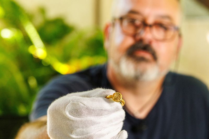 Igor Miholjek, head of research, Croatian Conservation Institute, Department of Underwater Archaeology, shows the golden signet ring, found in a Byzantium shipwreck near Polace on the island of Mljet