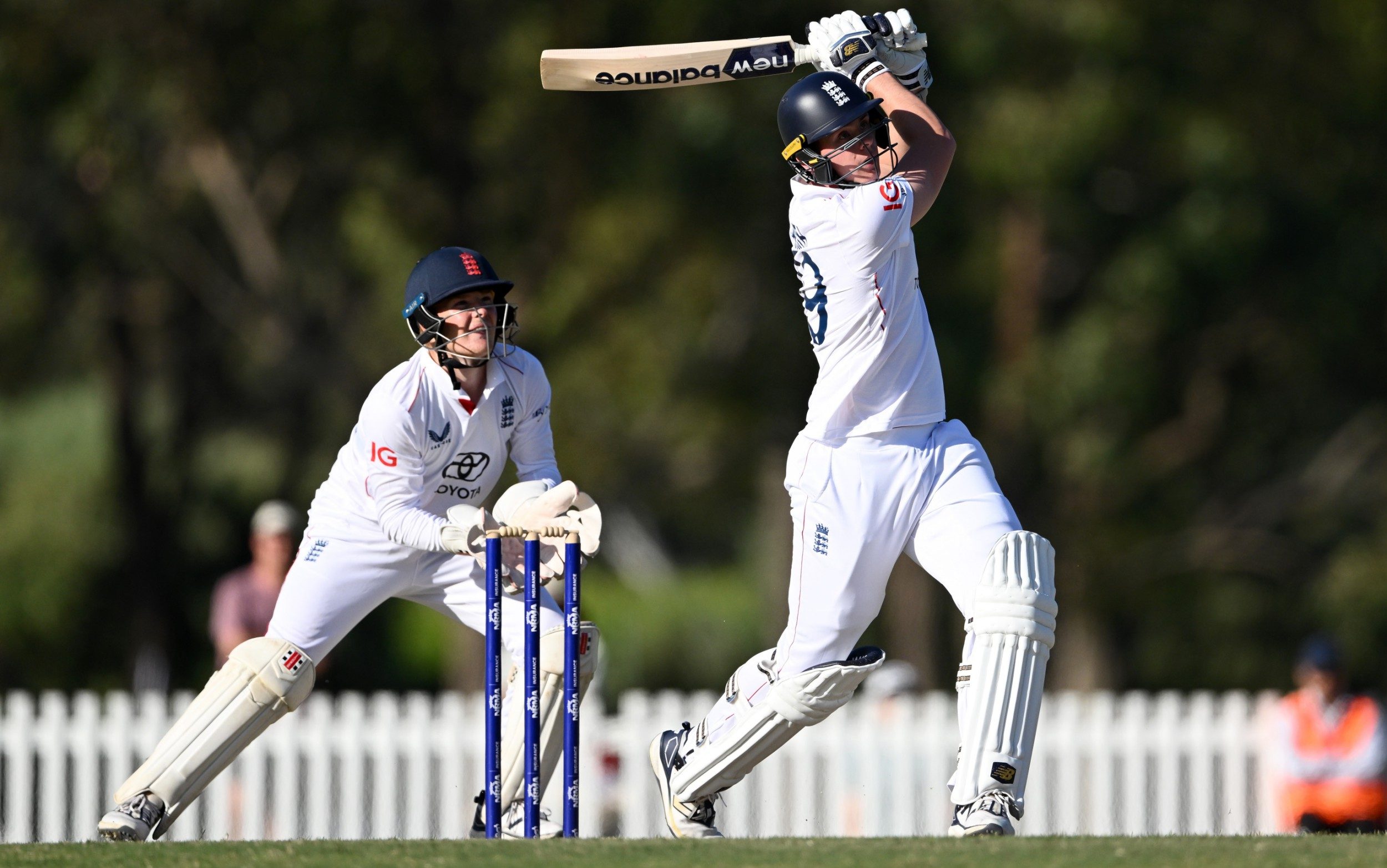 Jamie Smith of England hits out for six runs watched by England Lions wicketkeeper Thomas Rew during the practice match between England and the Lions at Lilac Hill on November 15, 2025 in Perth, Australia
