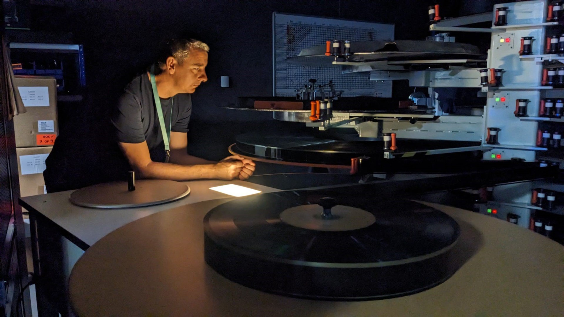 Science Museum IMAX Projection Manager Matthew Raymond supervising the running of Oppenheimer in the booth
